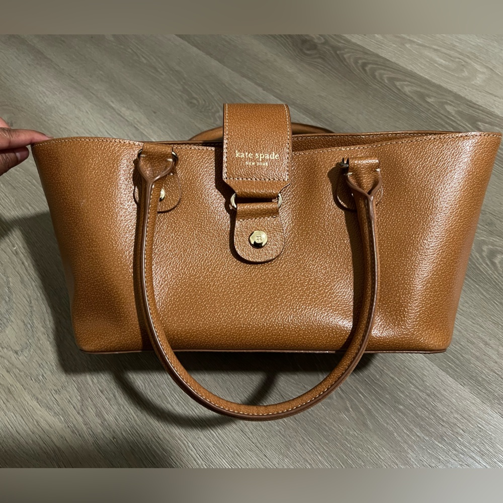 Kate Spade cognac brown leather purse with button clasp. Polka dot lining